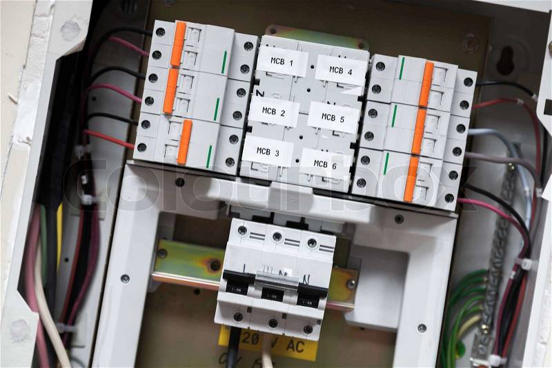 Electrical panel with automatic circuit breakers and wires, stock photo