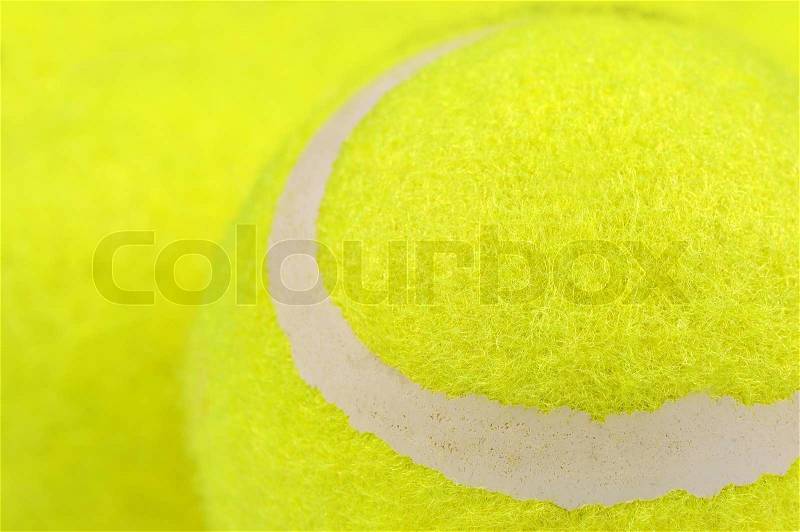A bright green lawn tennis ball with copy space, stock photo