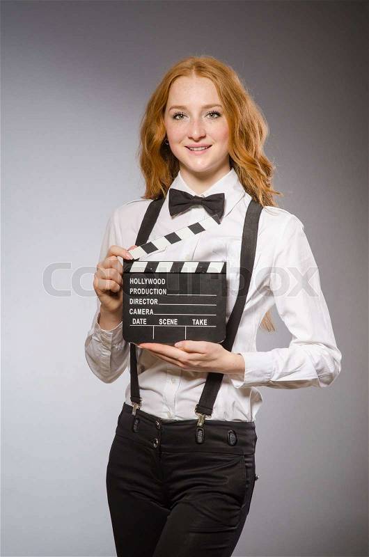Young woman with movie board , stock photo