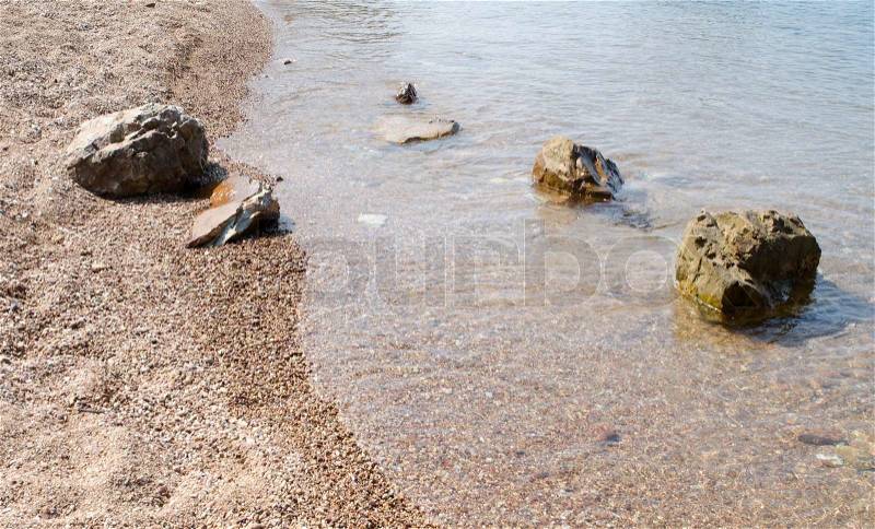 Rocks on the beach in Tropical sea at Bamboo Island Krabi Province Southeast Asia Thailand, stock photo