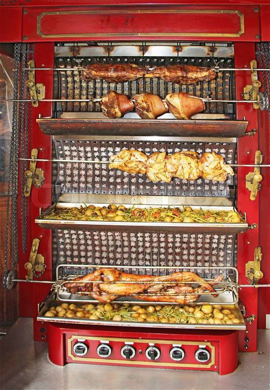 Roasted pig and chicken on the rack, stock photo