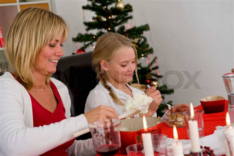 A caucasian family enjoying their Christmas lunch, stock photo