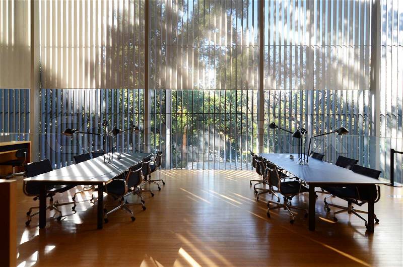 Interior of modern learning center with dramatic sunlight, stock photo
