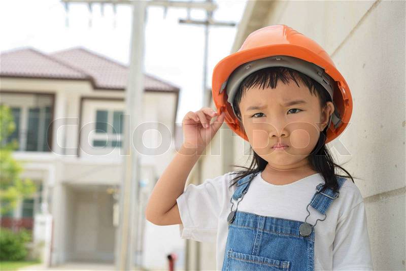 Little look worry about something after inspected her work , stock photo