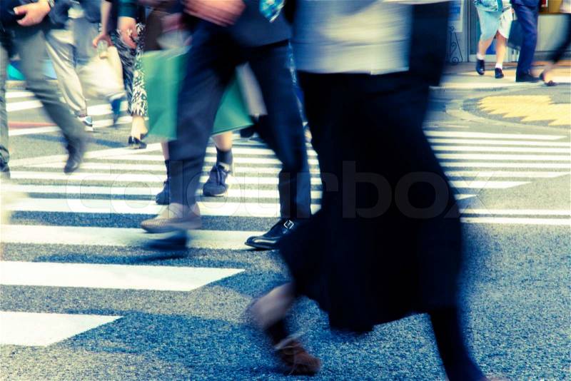 People commuting in rush hour at zebra crossing,Tokyo japan, stock photo