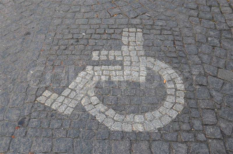 Handicap parking sign made of grey coloured stones, stock photo