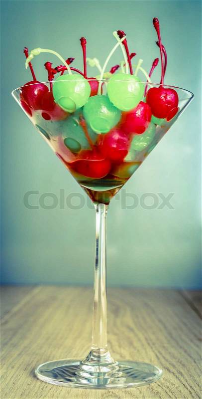 Glace cherries in martini glass, stock photo