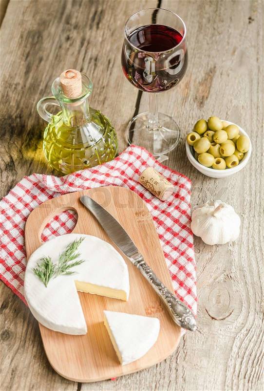 Camembert cheese and red wine, stock photo