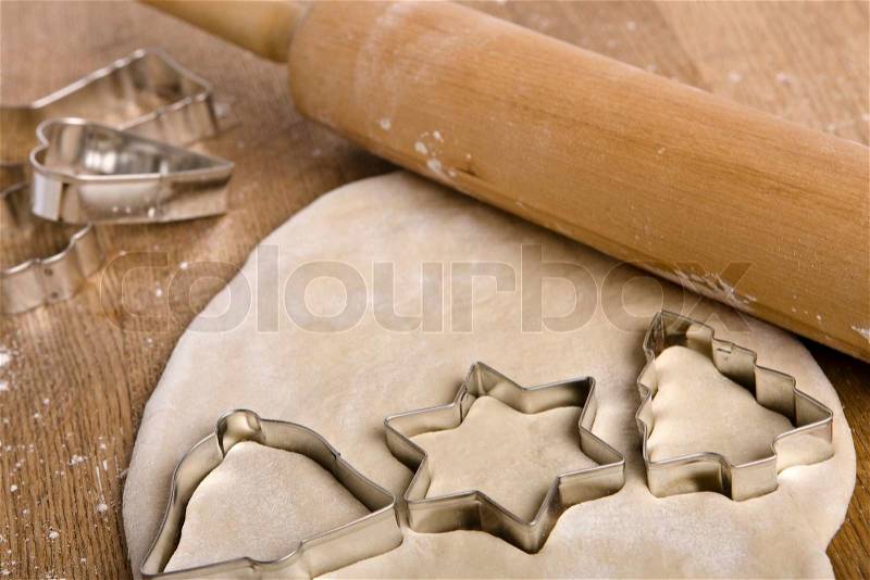 Christmas cookie cutters on cookie dough, stock photo