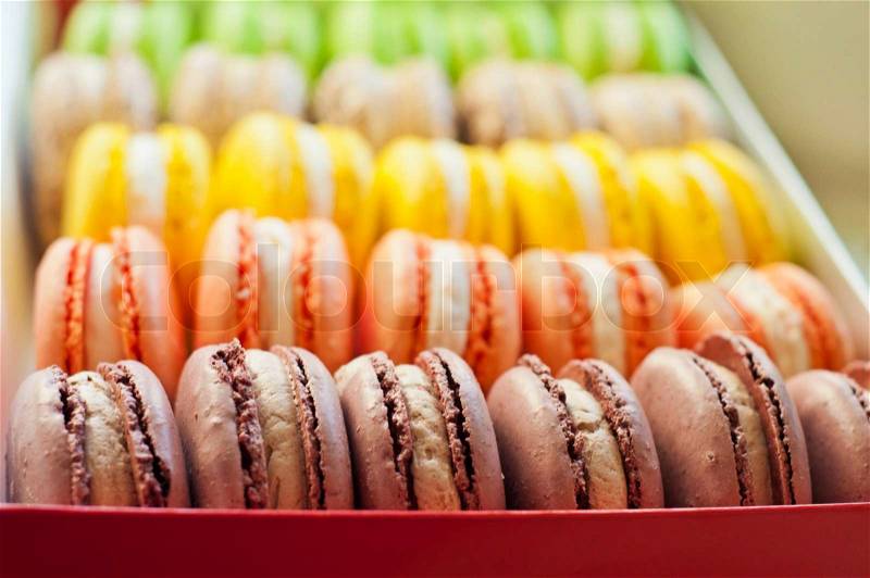 The many sweet colorful macaroons in box, stock photo