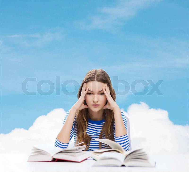 Education and home concept - stressed student girl with books, stock photo