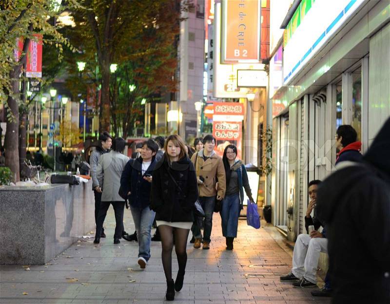 TOKYO - NOVEMBER 23: People visit street life in Shinjuku November 23 2013. Shinjuku is a special ward located in Tokyo Metropolis, Japan. It is a major commercial and administrative centre , stock photo