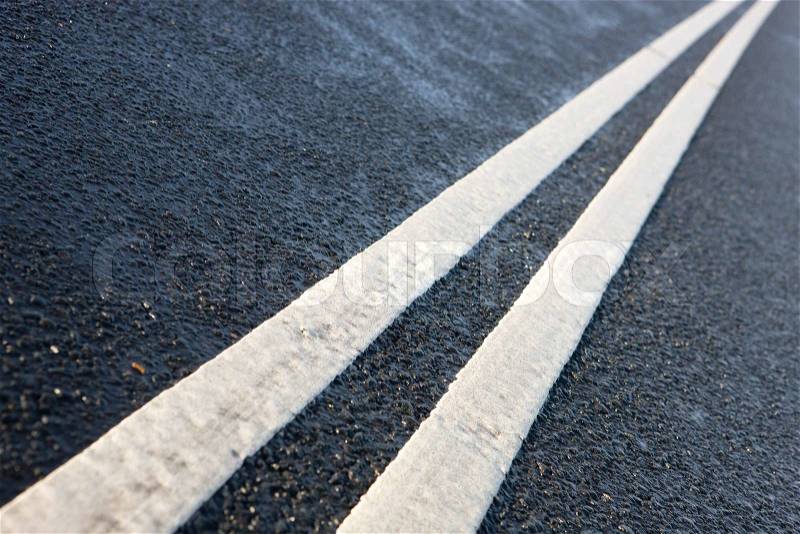 Road marking on an asphalt road, stock photo