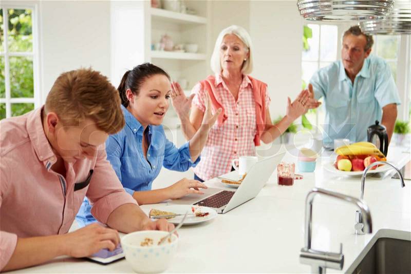 Family With Adult Children Having Argument At Breakfast, stock photo