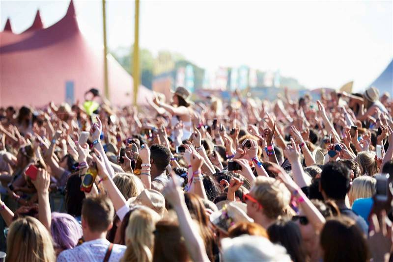 Crowds Enjoying Themselves At Outdoor Music Festival, stock photo
