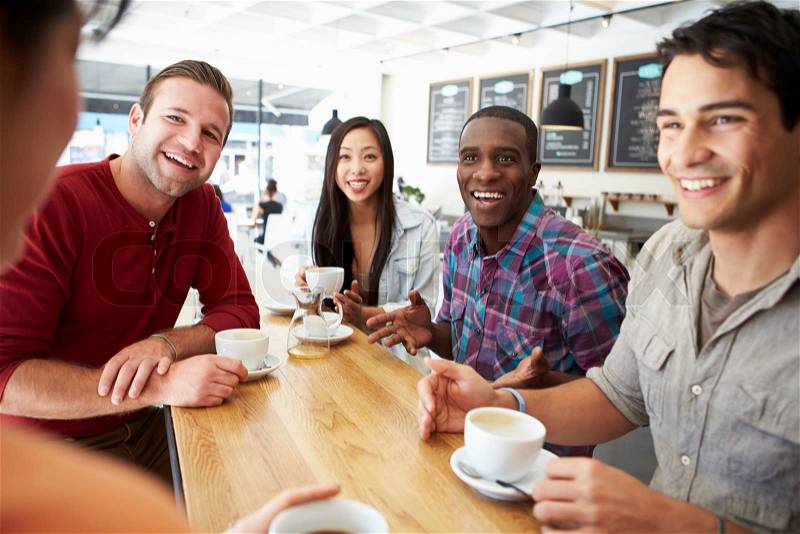 Group Of Friends Meeting In Coffee Shop, stock photo