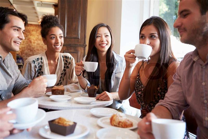 Group Of Female Friends Meeting In Café Restaurant, stock photo