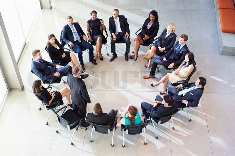 Businessman Addressing Multi-Cultural Office Staff Meeting, stock photo