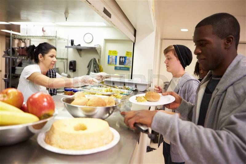 Kitchen Serving Food In Homeless Shelter, stock photo