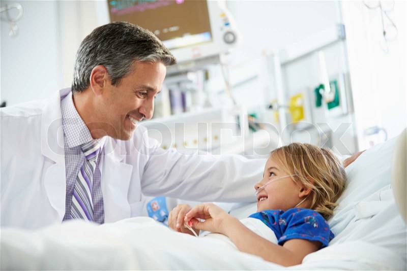 Young Girl Talking To Male Doctor In Intensive Care Unit, stock photo