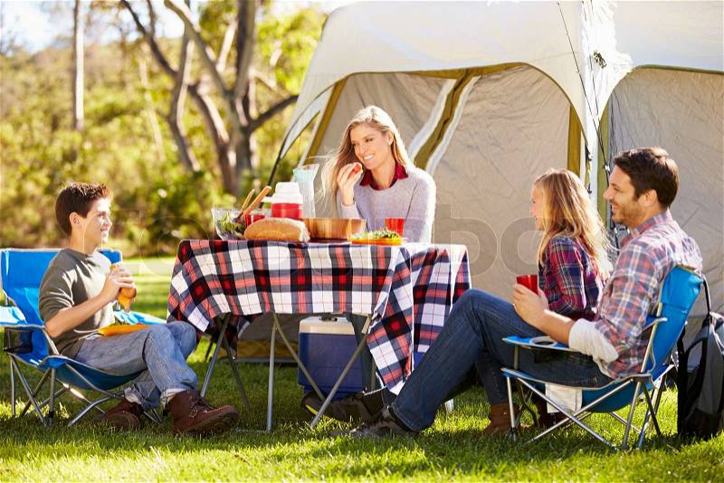 Family Enjoying Camping Holiday In Countryside, stock photo