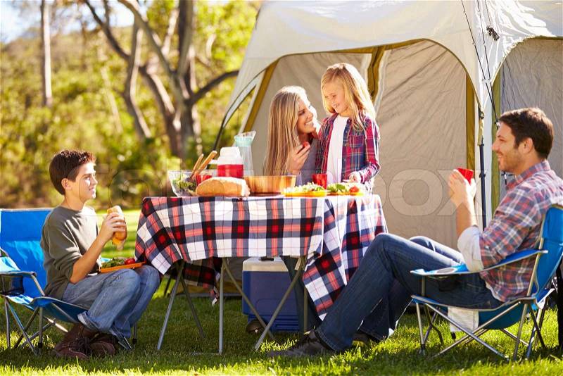 Family Enjoying Camping Holiday In Countryside, stock photo