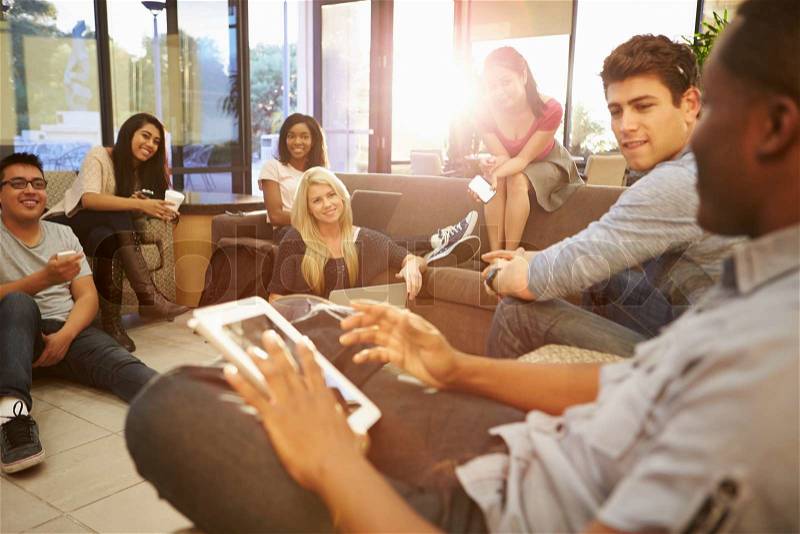 Group Of University Students Relaxing In Common Room, stock photo