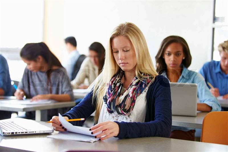 Female High School Student Studying At Desk, stock photo