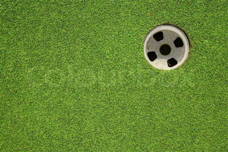 Golf hole on a field, stock photo