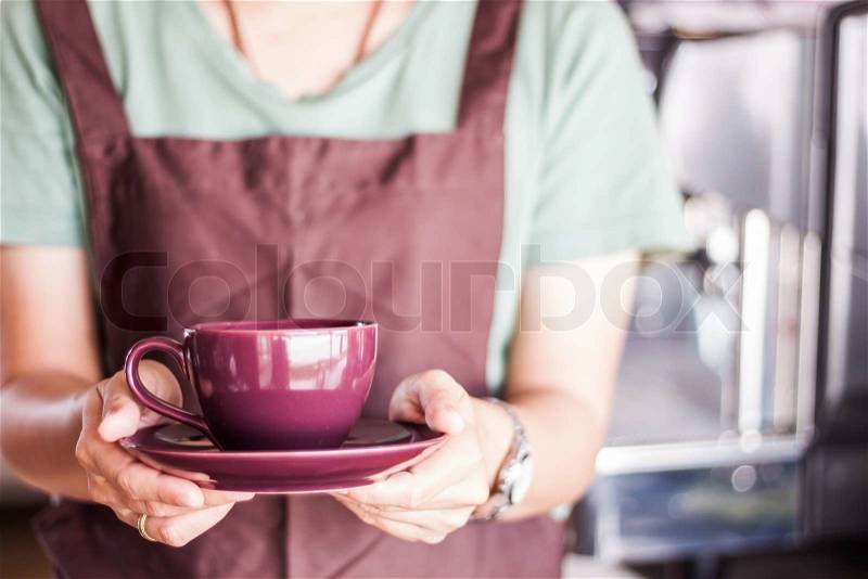 Shop owner serving freshly brewed coffee, stock photo, stock photo