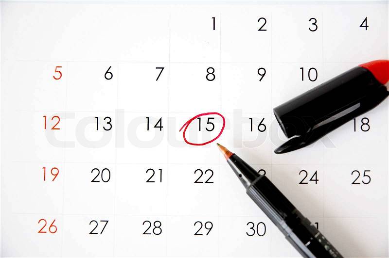 Red pen marked on date fifteen, stock photo