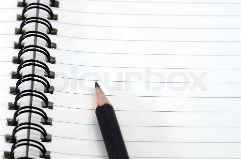 Pencil and spiral bound notebook, stock photo