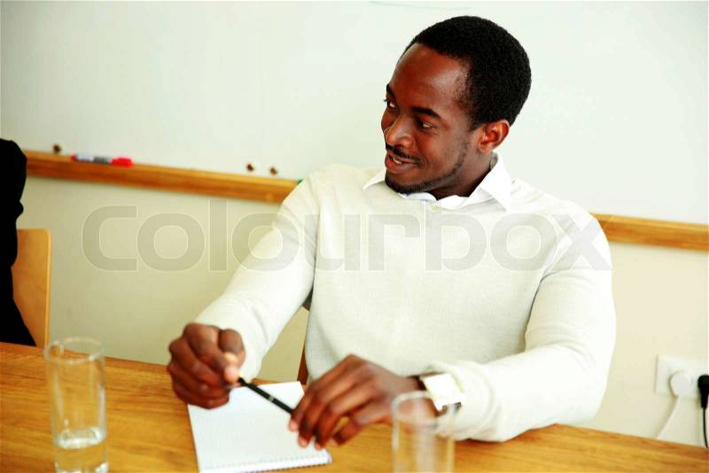 Happy african businessman at the meeting in office, stock photo