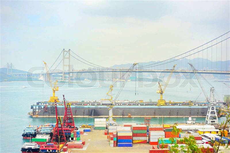 Hong Kong comercial container port . Tsing Ma bride on background, stock photo