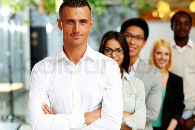 Happy group of business people in the office lined up, stock photo