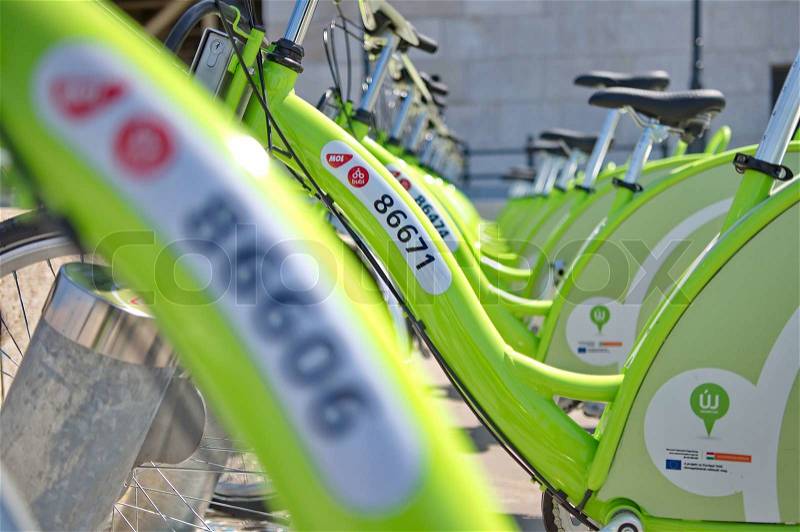 BUDAPEST, HUNGARY - JUNE 01 2014:Auckland waterfront bike hire.Many cities around the world have bicycle sharing systems or community bicycle programs.The first was the White Bicycle plan in Amsterdam in 1965, stock photo
