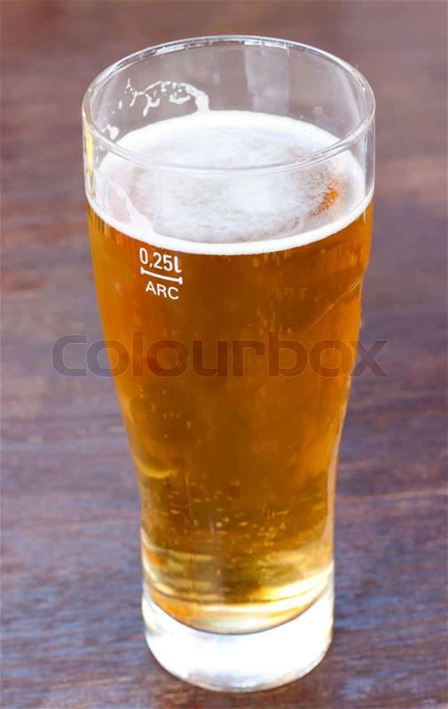 Glass of light beer on the wood background. , stock photo