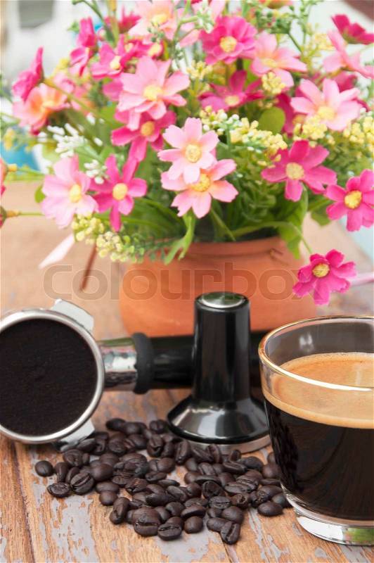 Hot coffee and coffee making equipment with flower clay pot, stock photo