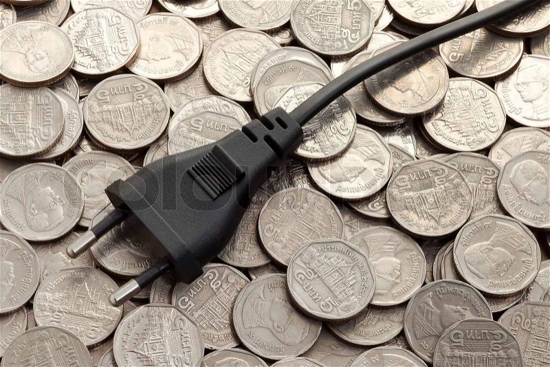 Power plug on money, stock photo