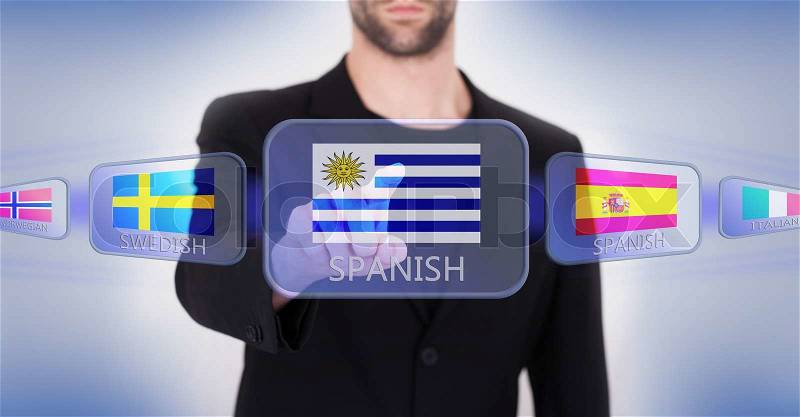 Hand pushing on a touch screen interface, choosing language or country, Uruguay, stock photo