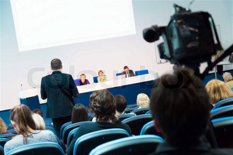 Business Conference and Presentation. Audience at the conference hall. Television broadcasted press conference, stock photo