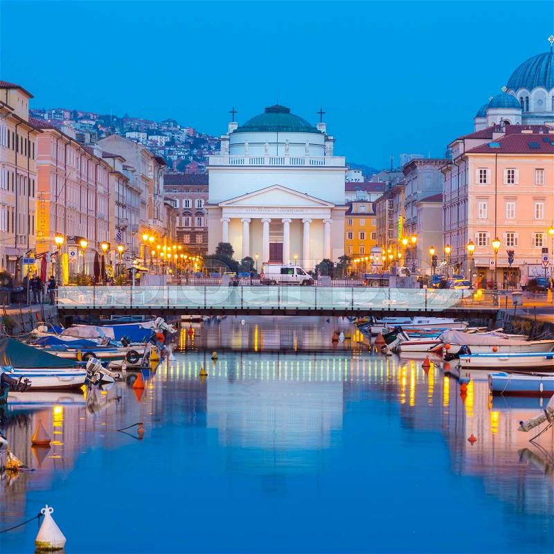 Huge church of St. Antonio Thaumaturgo is situated at northern end of Canale Grande. Its neo classical front facade and cupola represents one of emblems of Trieste, city and seaport in Italy, Europe, stock photo