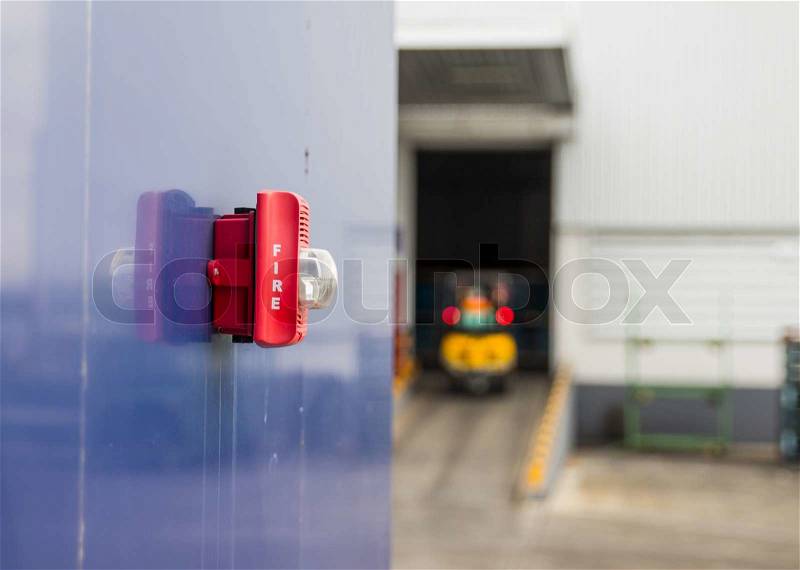 A fire alarm with built in strobe light to alert in case of fire on factory, stock photo