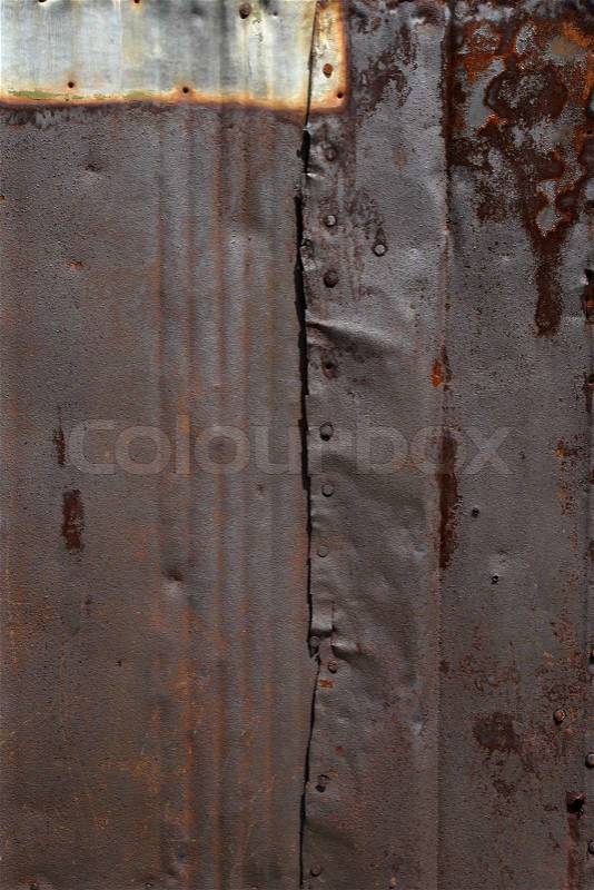 Battered, damaged, grunge rusty sheet metal background, stock photo