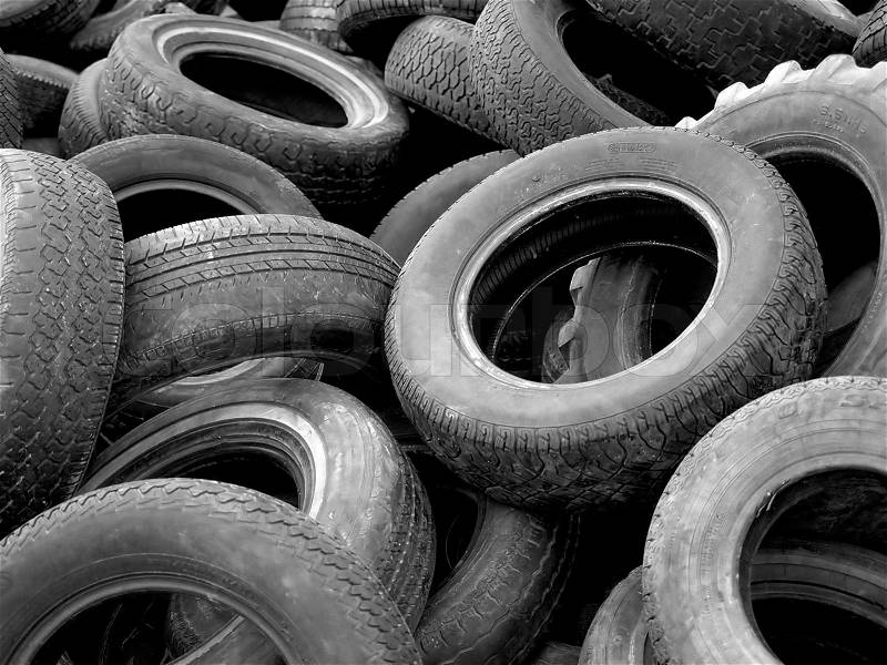 A heap of discarded car and truck tires. 35mm film scan, stock photo