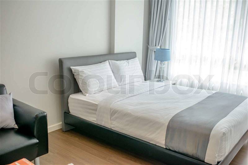 Nice Bed in typical contemporary setting, selective focus, stock photo