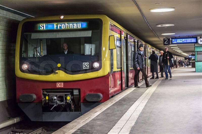BERLIN - JUNE 5: People at Potsdamer Platz subway station on 5 June 2013 in Berlin, Germany. The Berlin U-Bahn is the most extensive underground network in Germany with a system length of 146 km, stock photo
