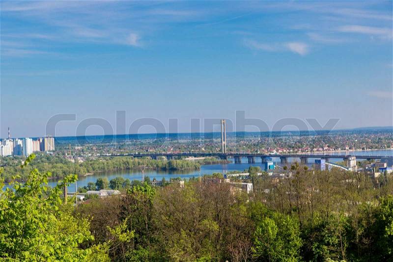 Panorama of city landscape and nature. Kiev, Ukraine. Green trees, architecture, and blue river, stock photo