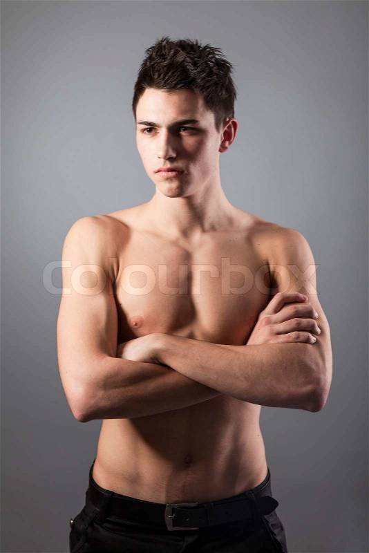 Portrait of young bodybuilder man on a black background, stock photo