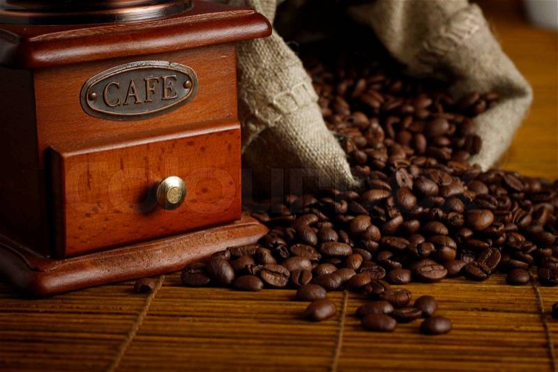 Coffee seeds on wooden table, stock photo